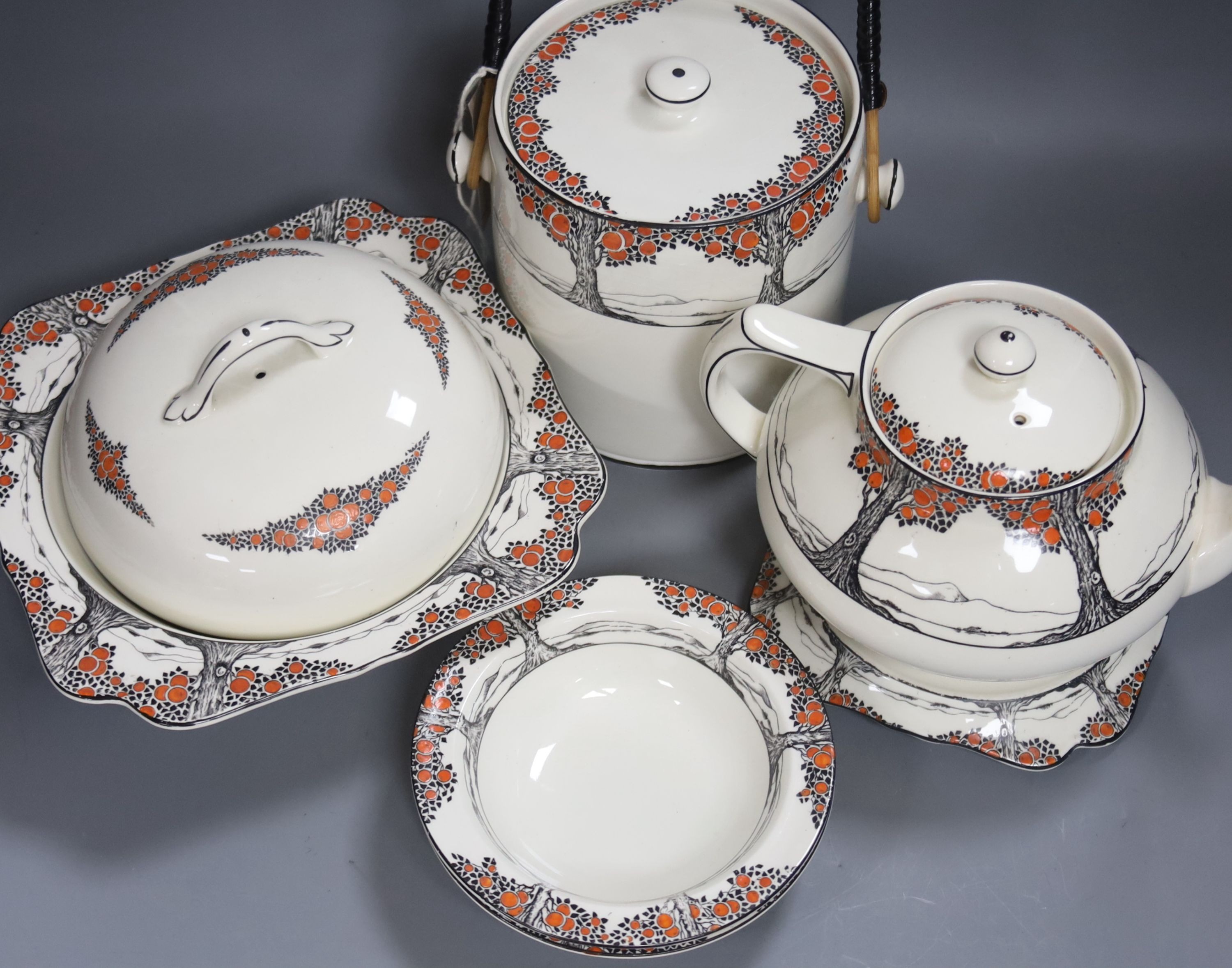 A Crown Ducal Art Deco 'Orange Tree' breakfast, tea and coffee service, to include a biscuit barrel, cheese dish and toast rack